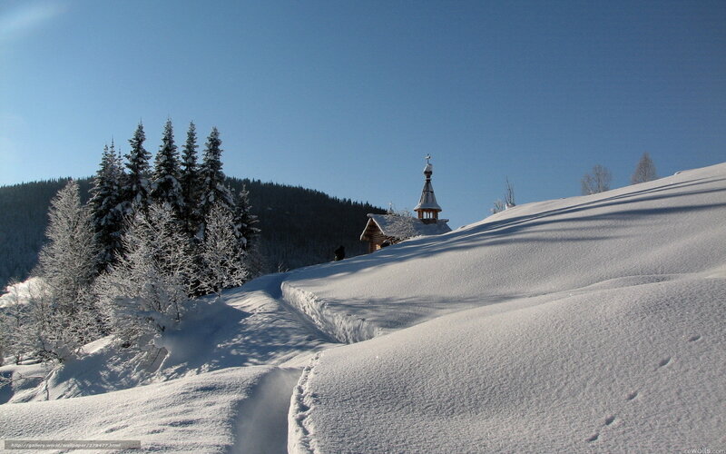 Snowy church on a winter hill