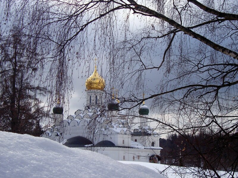 Snowy church with golden dome