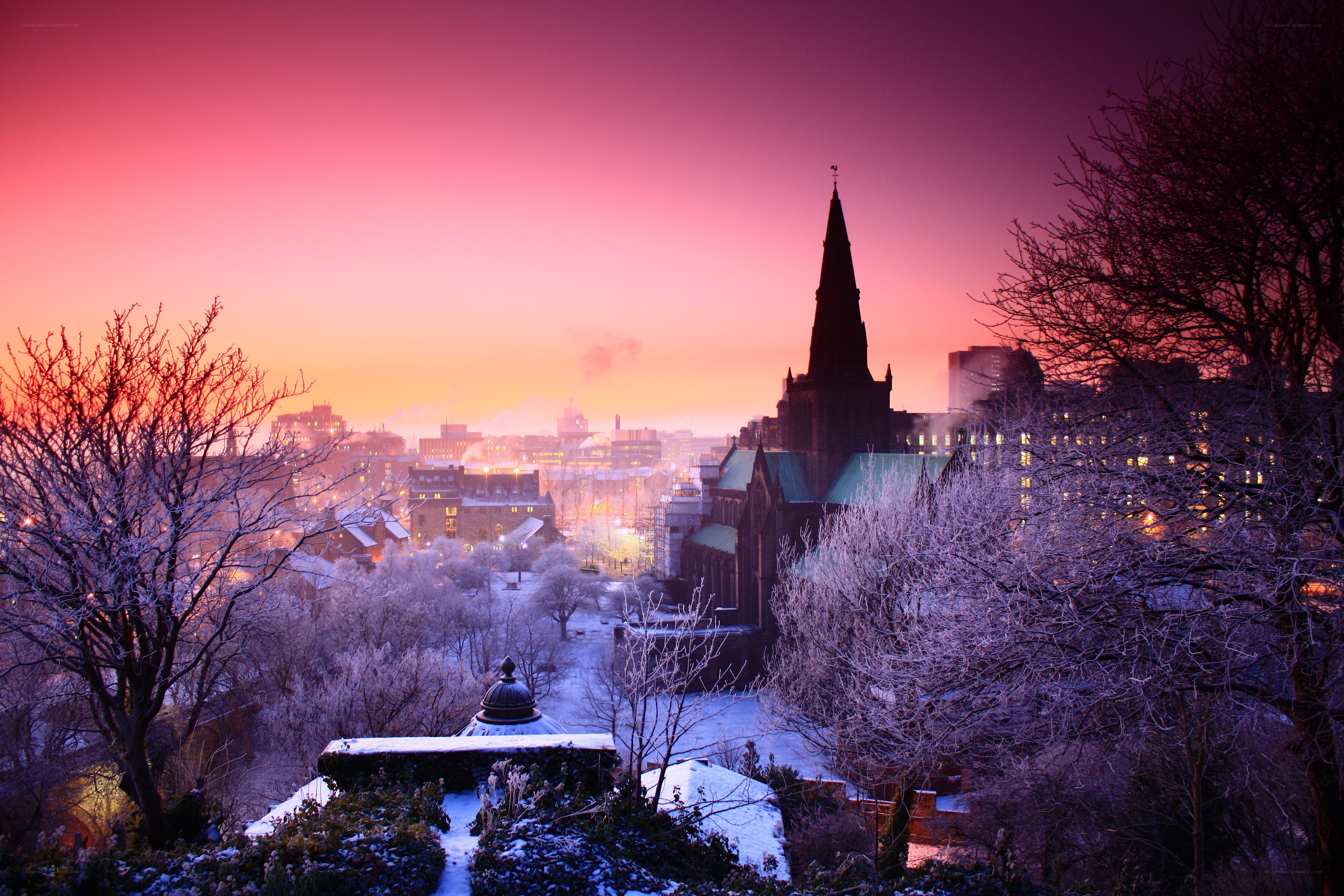 Snowy city at sunset