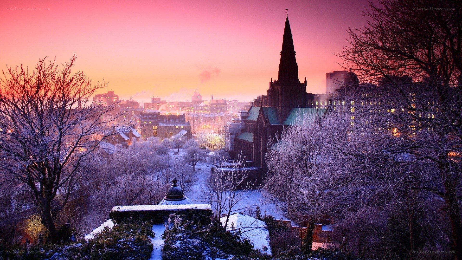 Snowy city at sunset