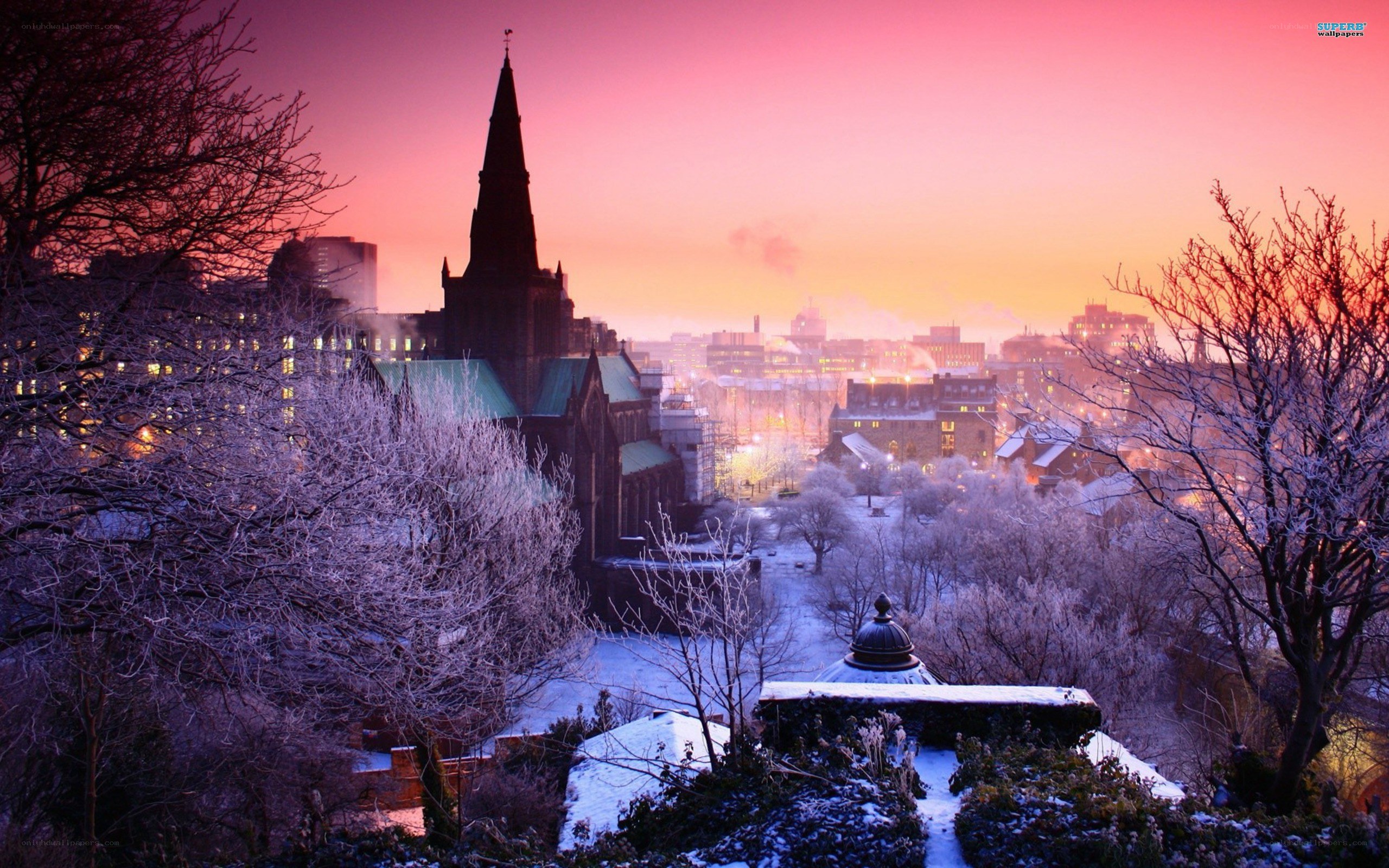 Snowy city at sunset