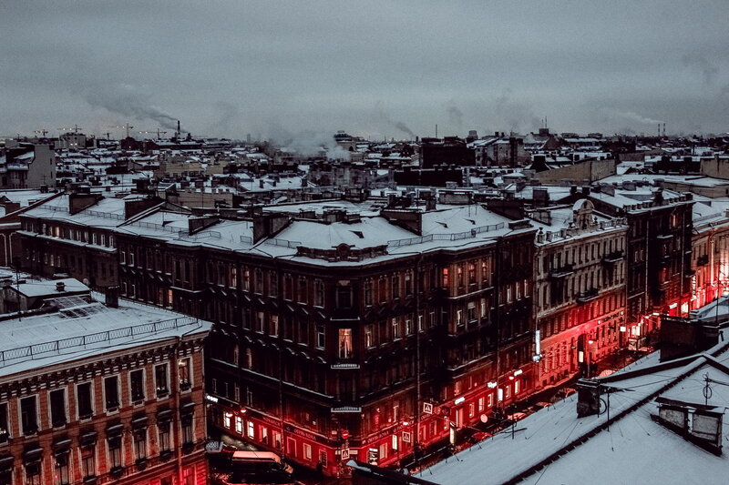 snowy city rooftops at dusk