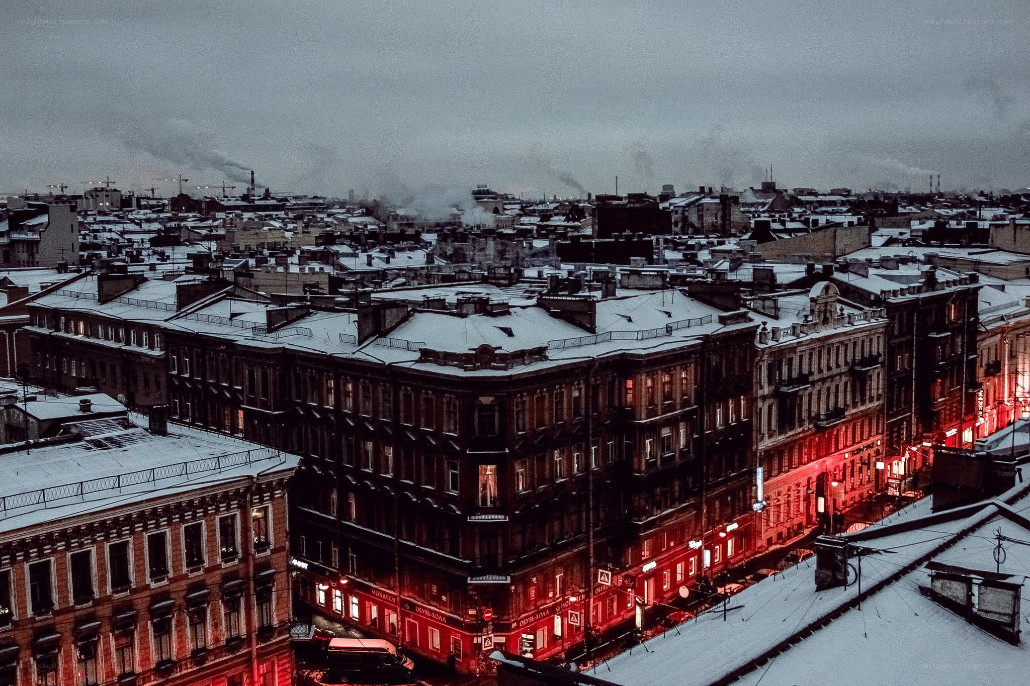 snowy city rooftops at dusk