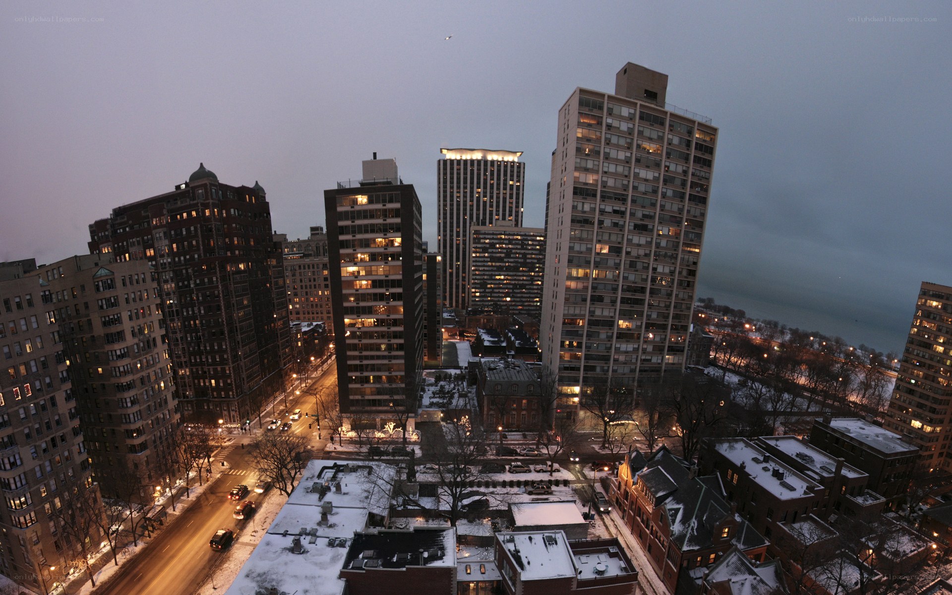 Snowy city skyline at dusk