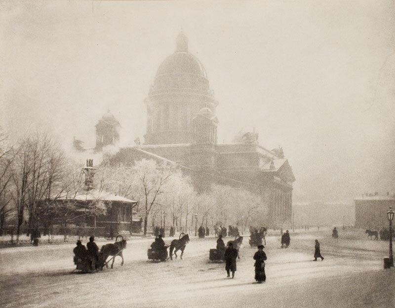 Snowy city square with cathedral