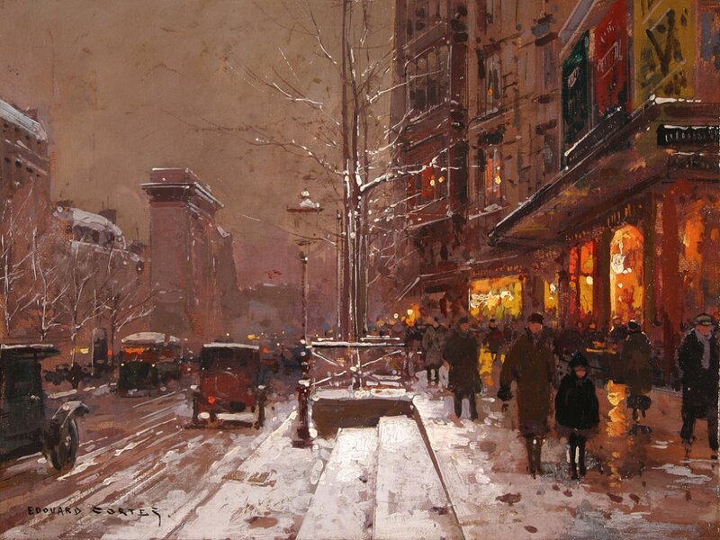 Snowy city street at dusk