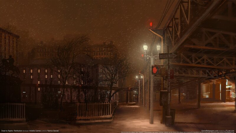 snowy city street at night
