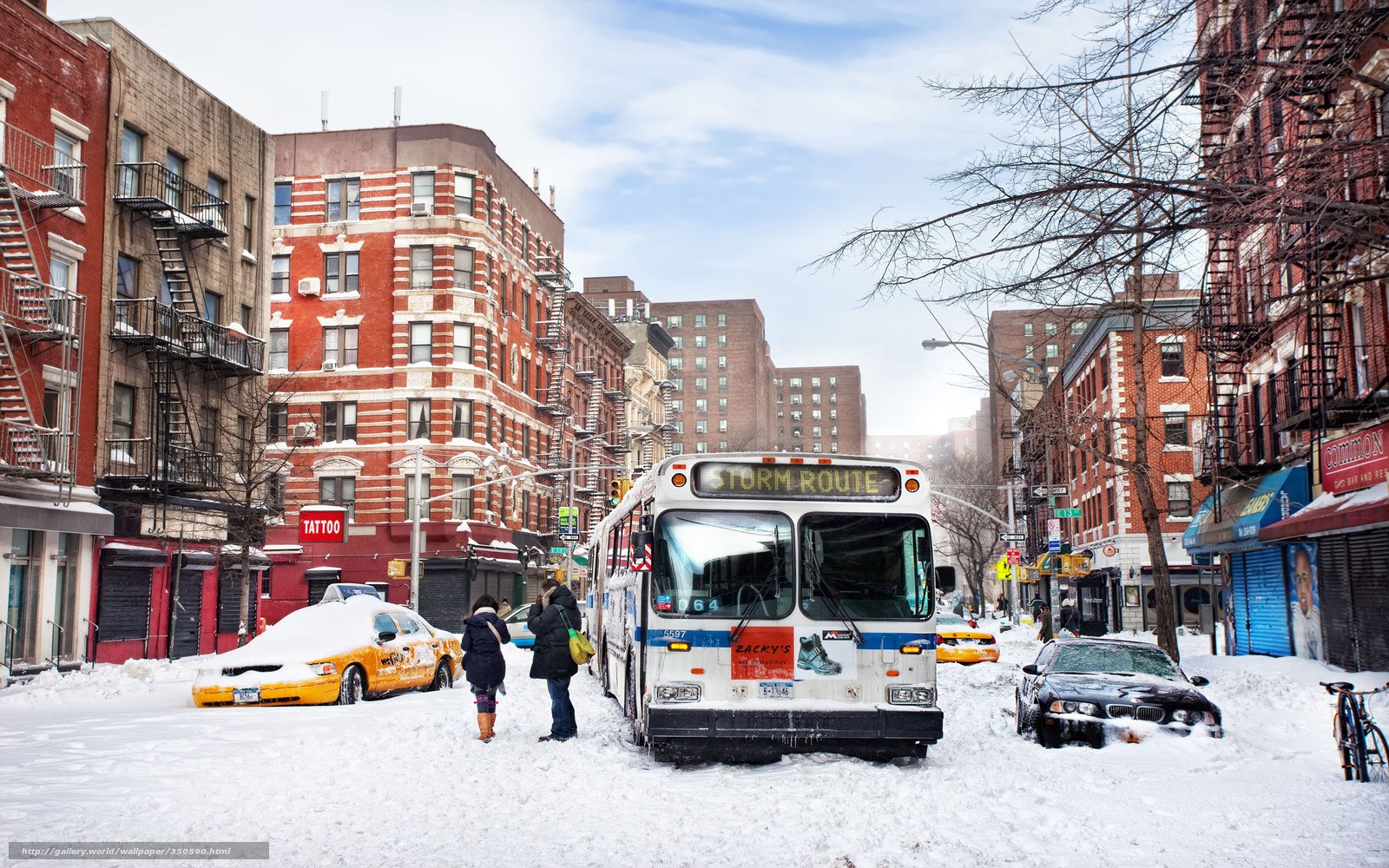 Snowy city street with bus