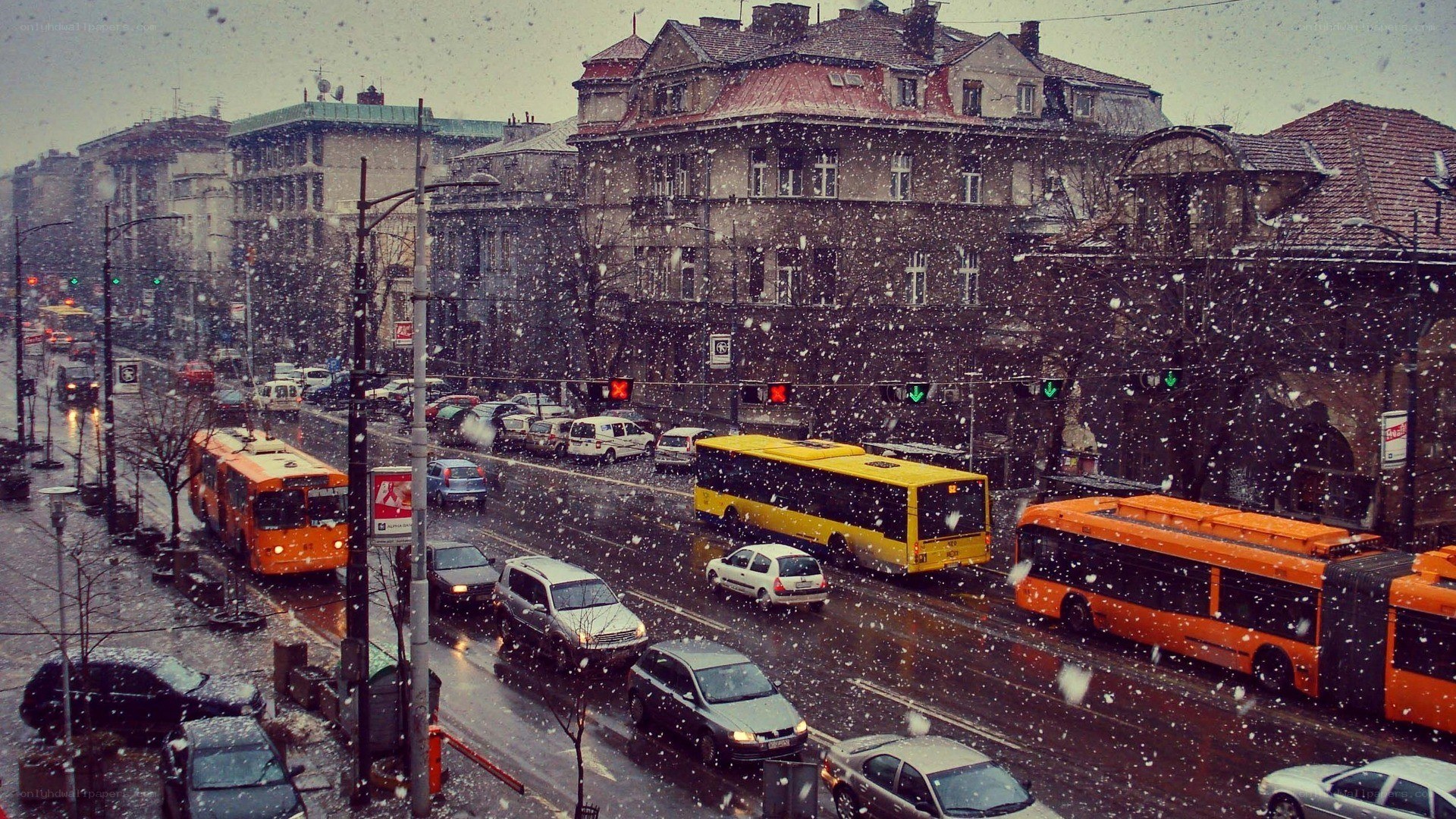 Snowy city traffic scene