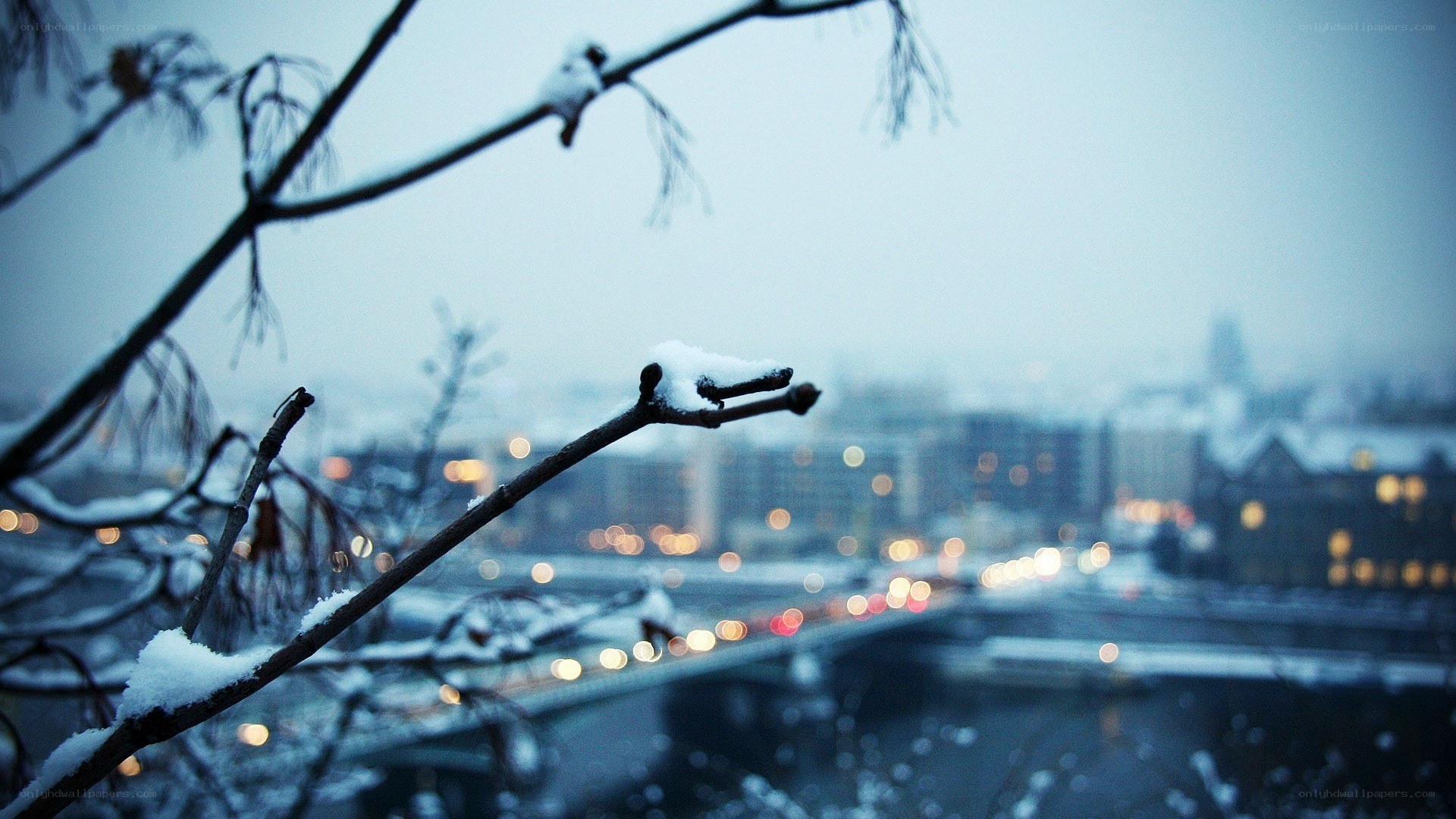 Snowy city view at dusk