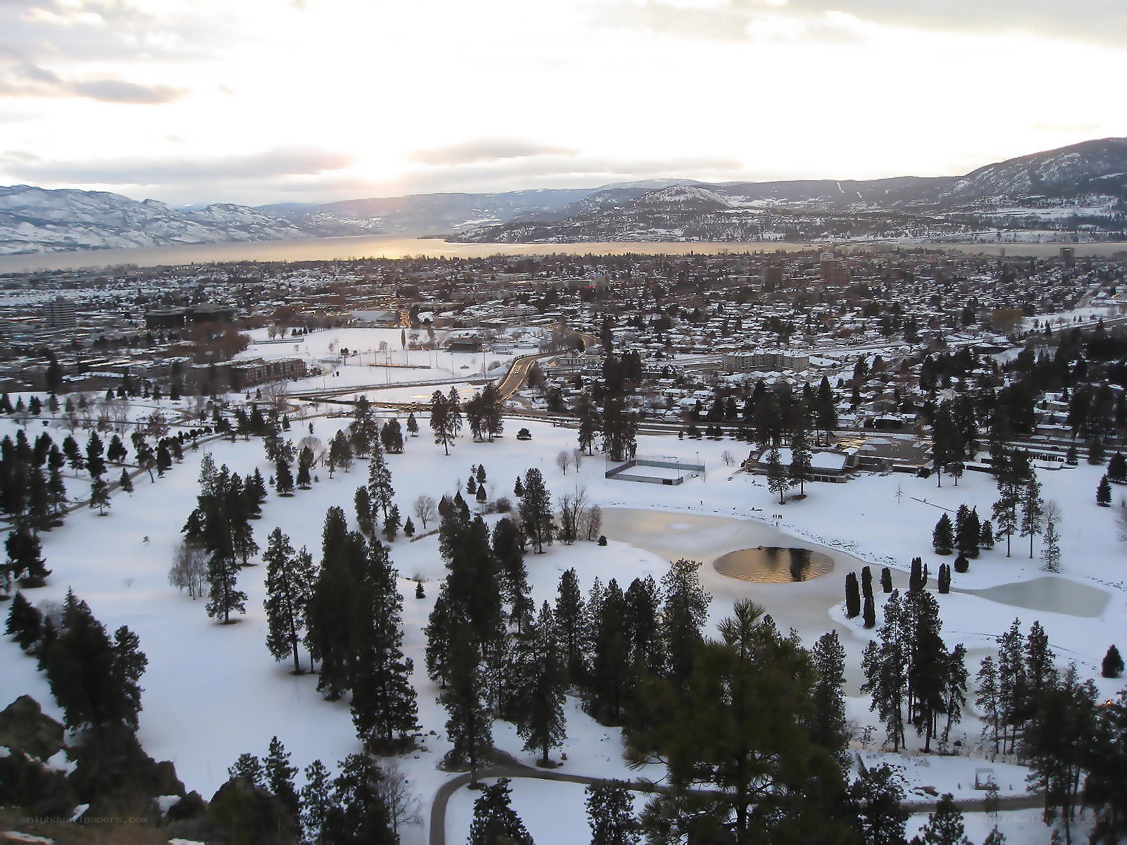 Snowy city view at sunset