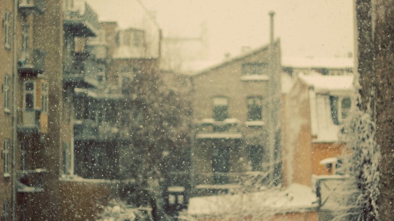 Snowy city view from window