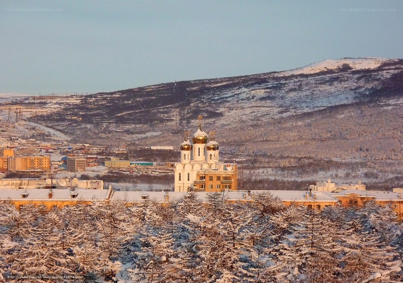 Snowy city with church dome