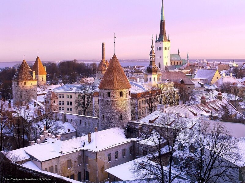 Snowy city with historic towers