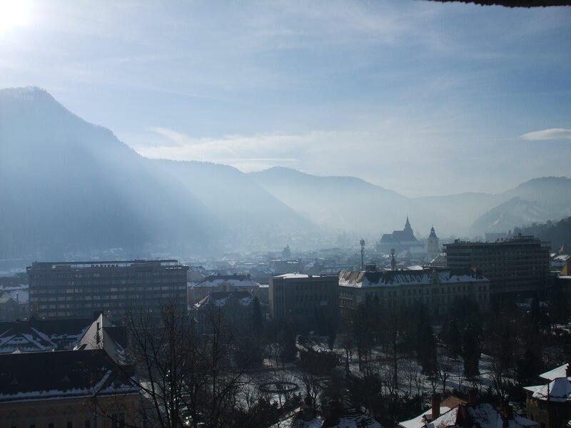 Snowy city with mountains