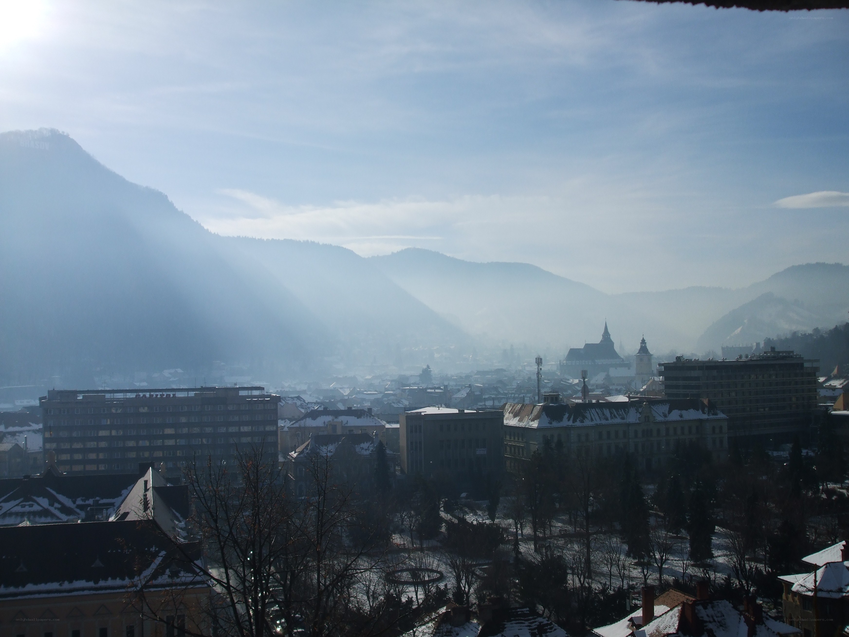 Snowy city with mountains