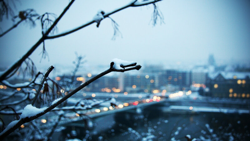 Snowy cityscape at dusk