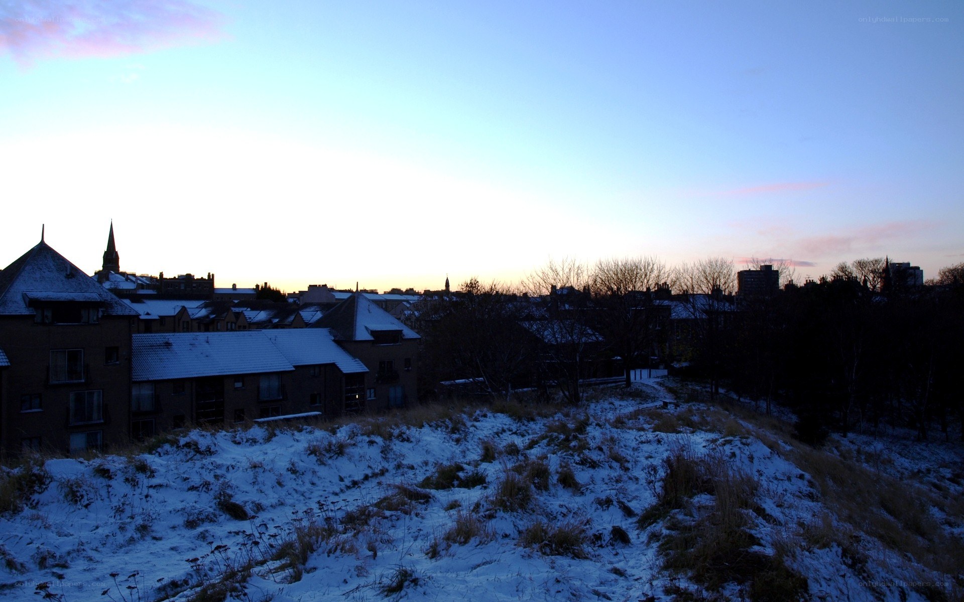 Snowy cityscape at dusk