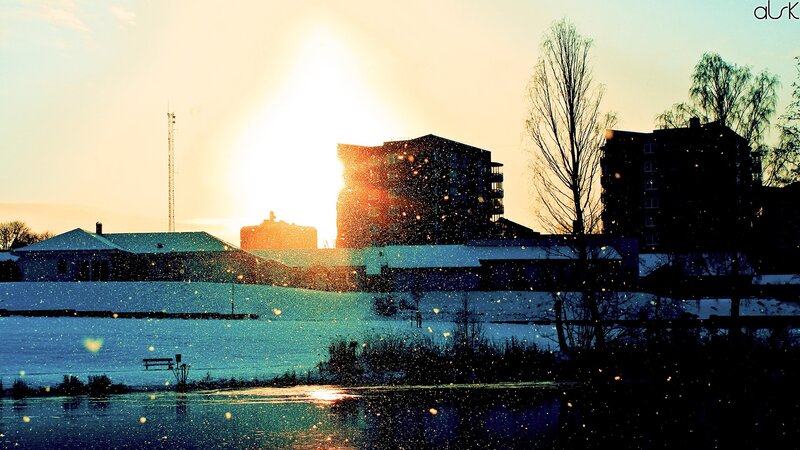 Snowy Cityscape at Sunset — Blue