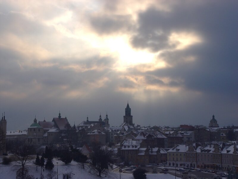 snowy cityscape at sunset
