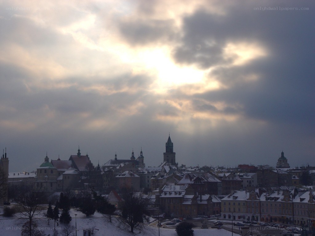 snowy cityscape at sunset