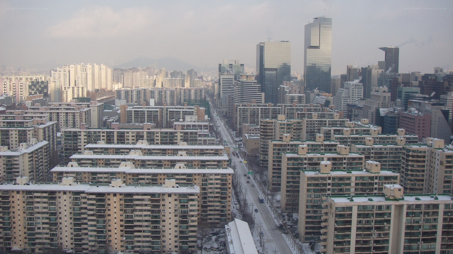 snowy cityscape with high-rises