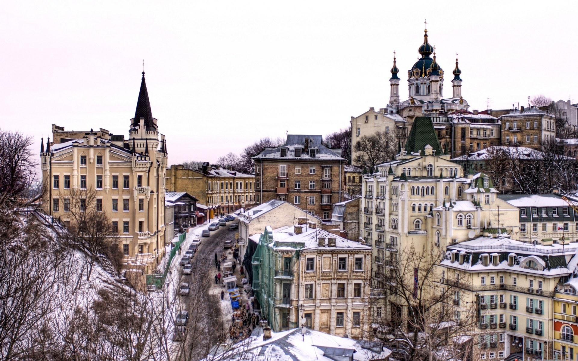 Snowy cityscape with historic buildings
