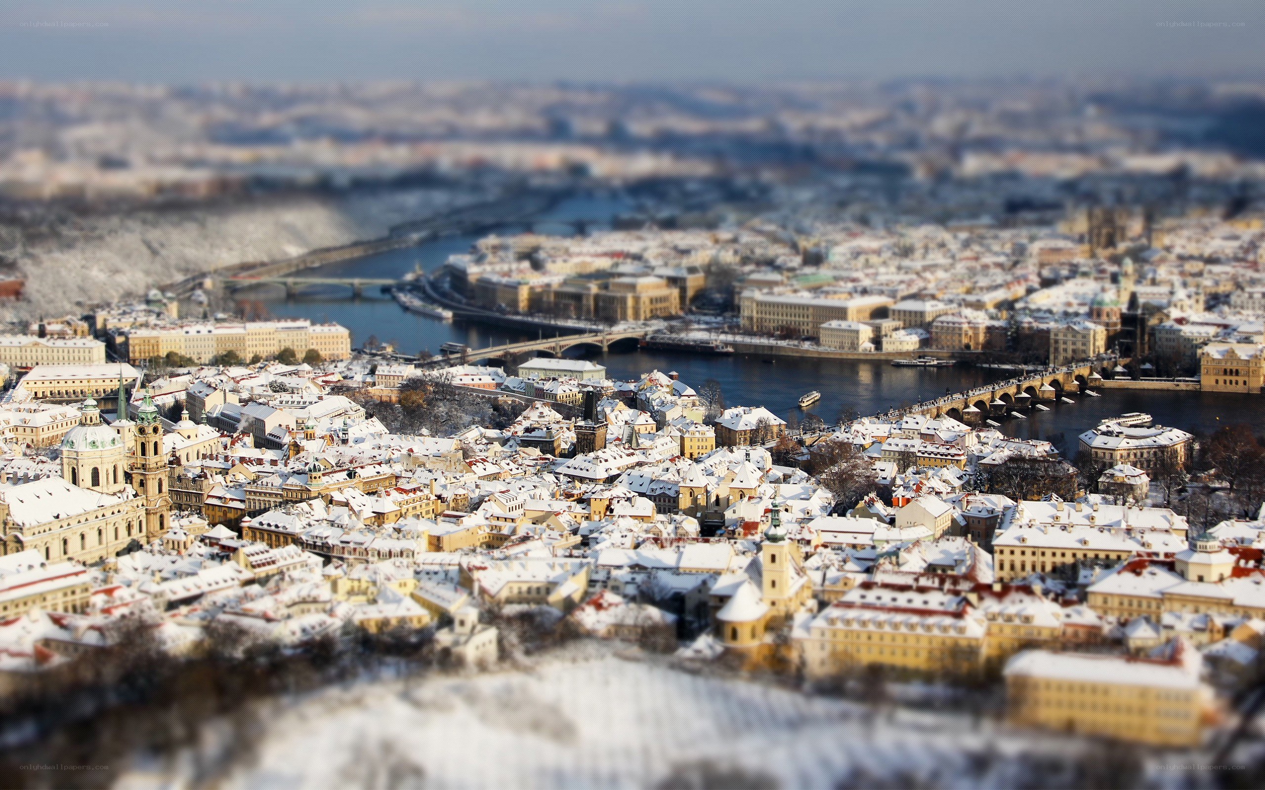 Snowy cityscape with river