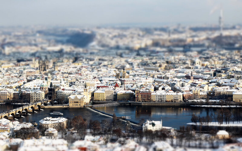 Snowy cityscape with river