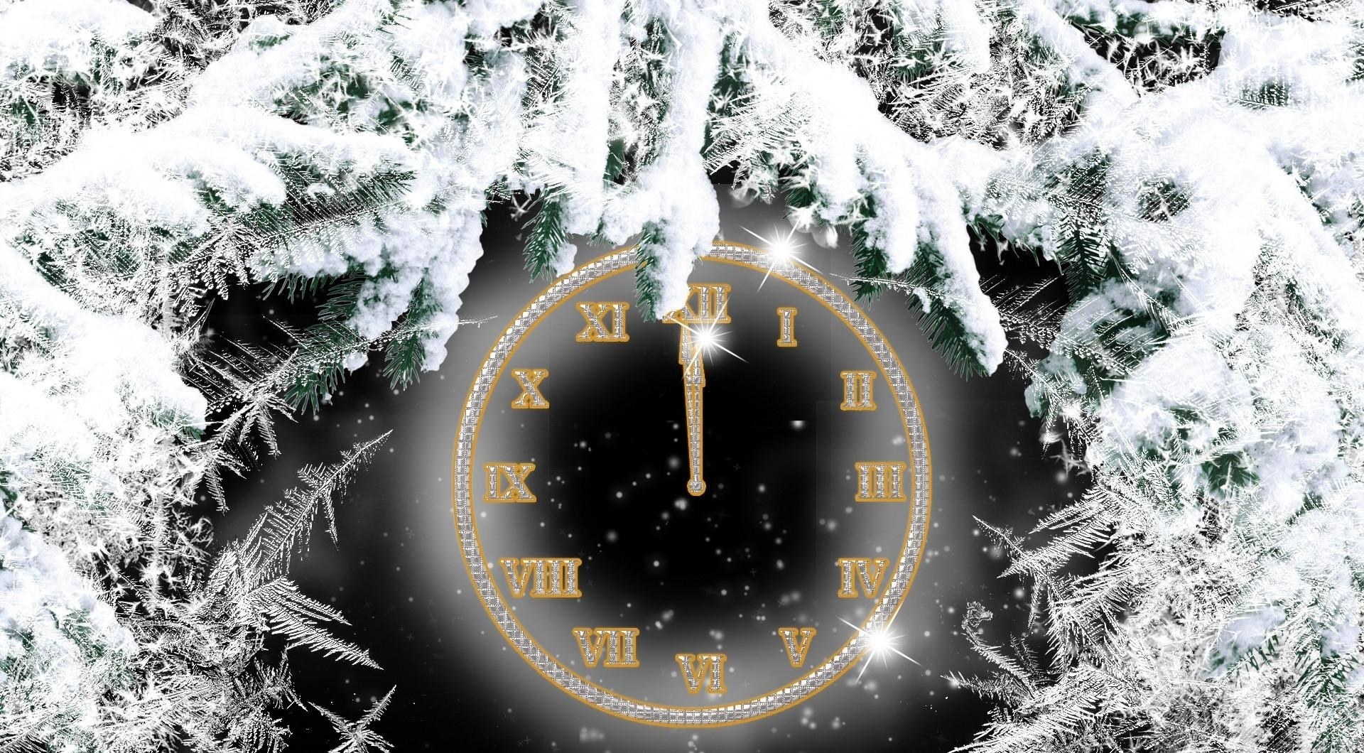 Snowy clock at midnight