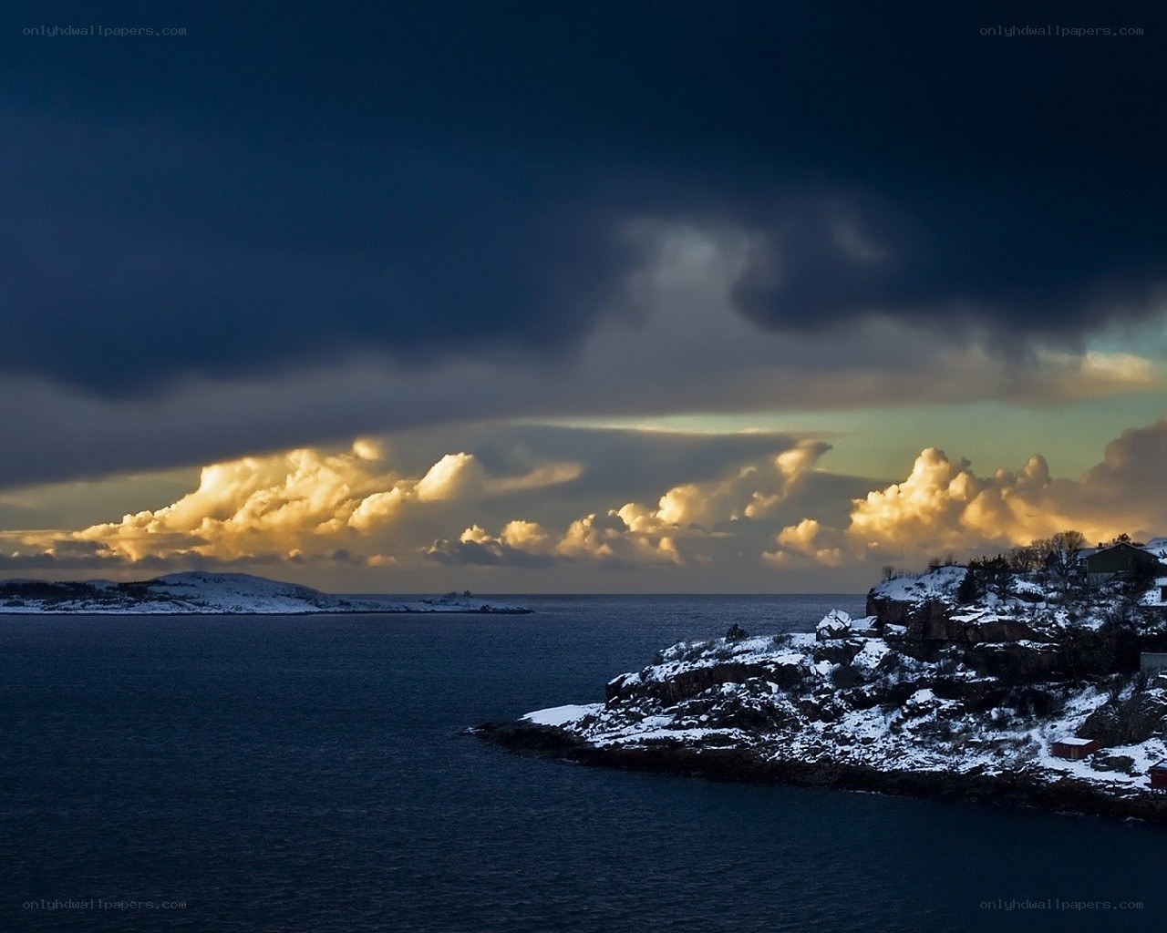 Snowy coastal sunset