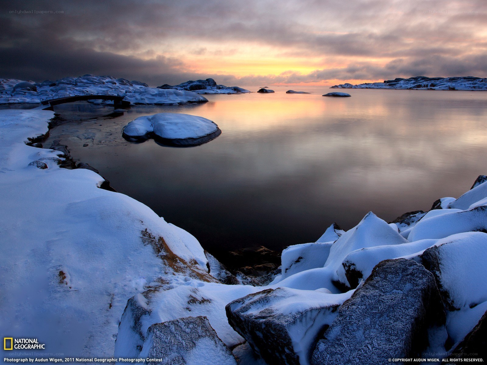 Snowy coastal sunset