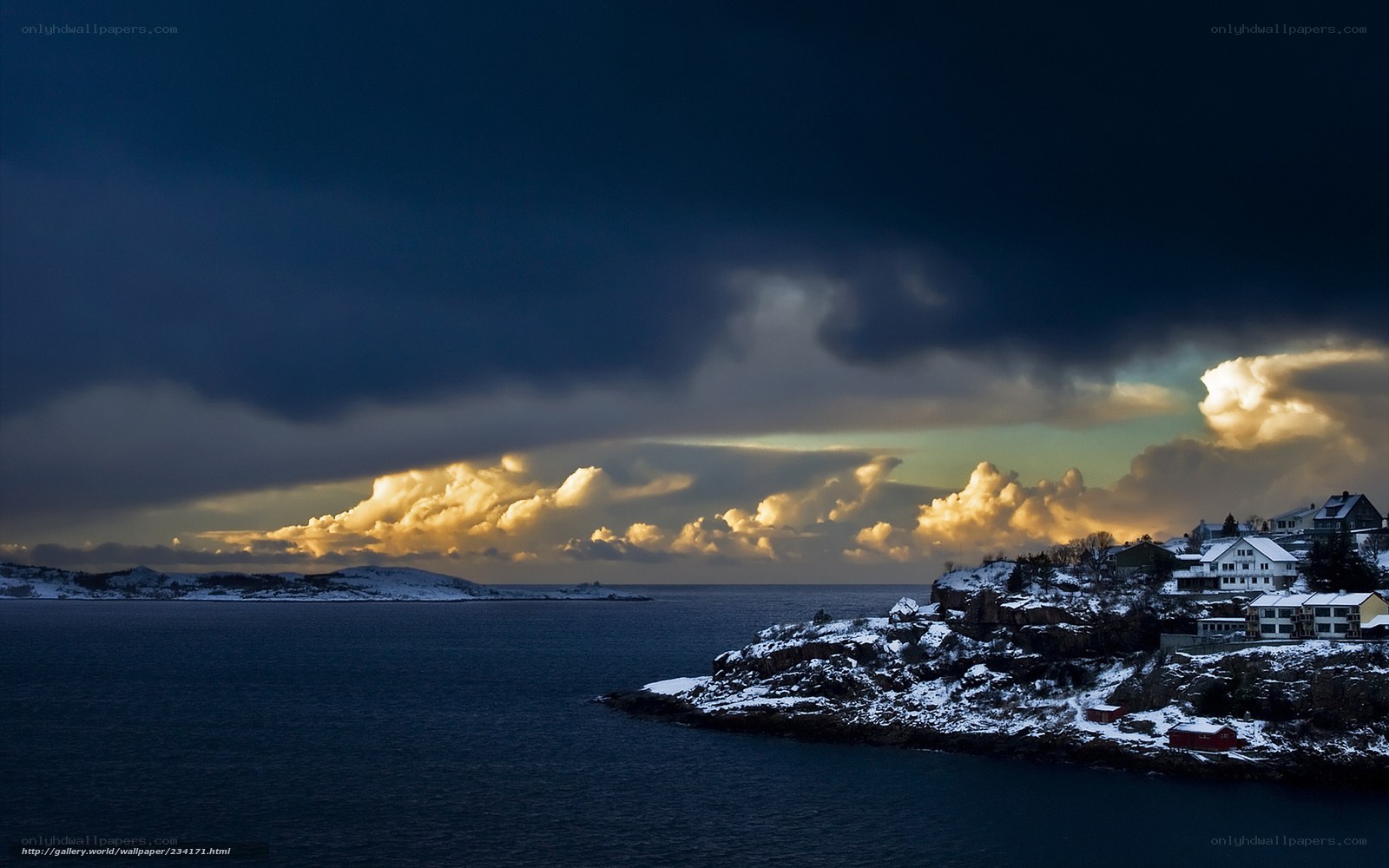 Snowy coastal town at dusk
