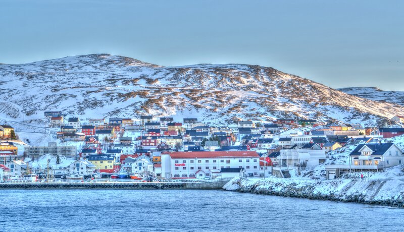 Snowy coastal town in Norway