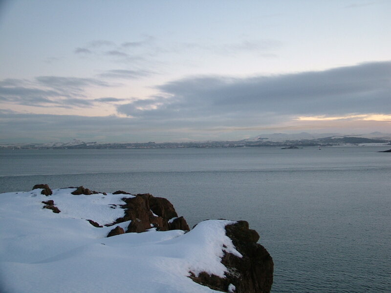 snowy coastal view at dusk