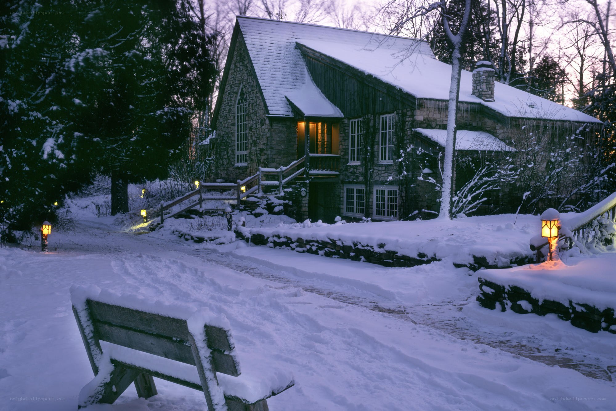 Snowy cottage at dusk