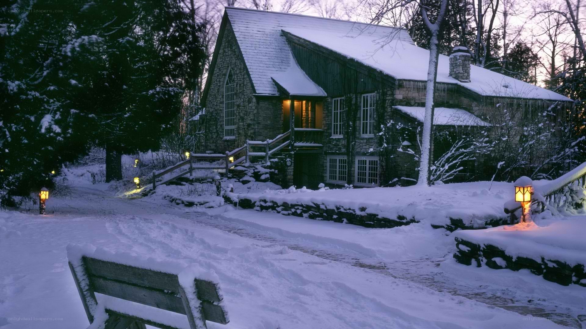 Snowy cottage at dusk
