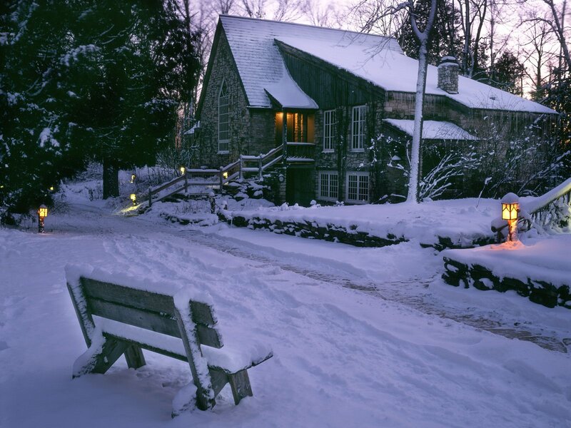 Snowy cottage at dusk