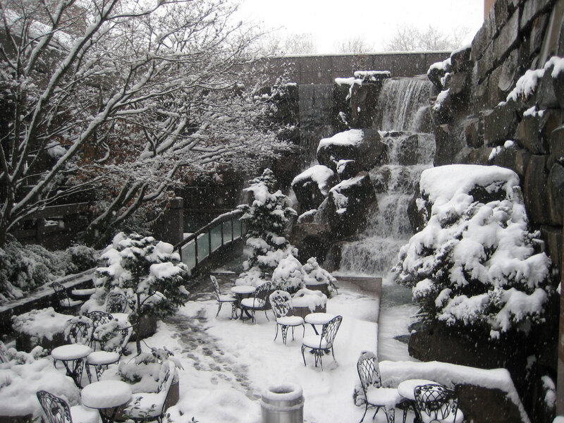 Snowy courtyard with waterfall