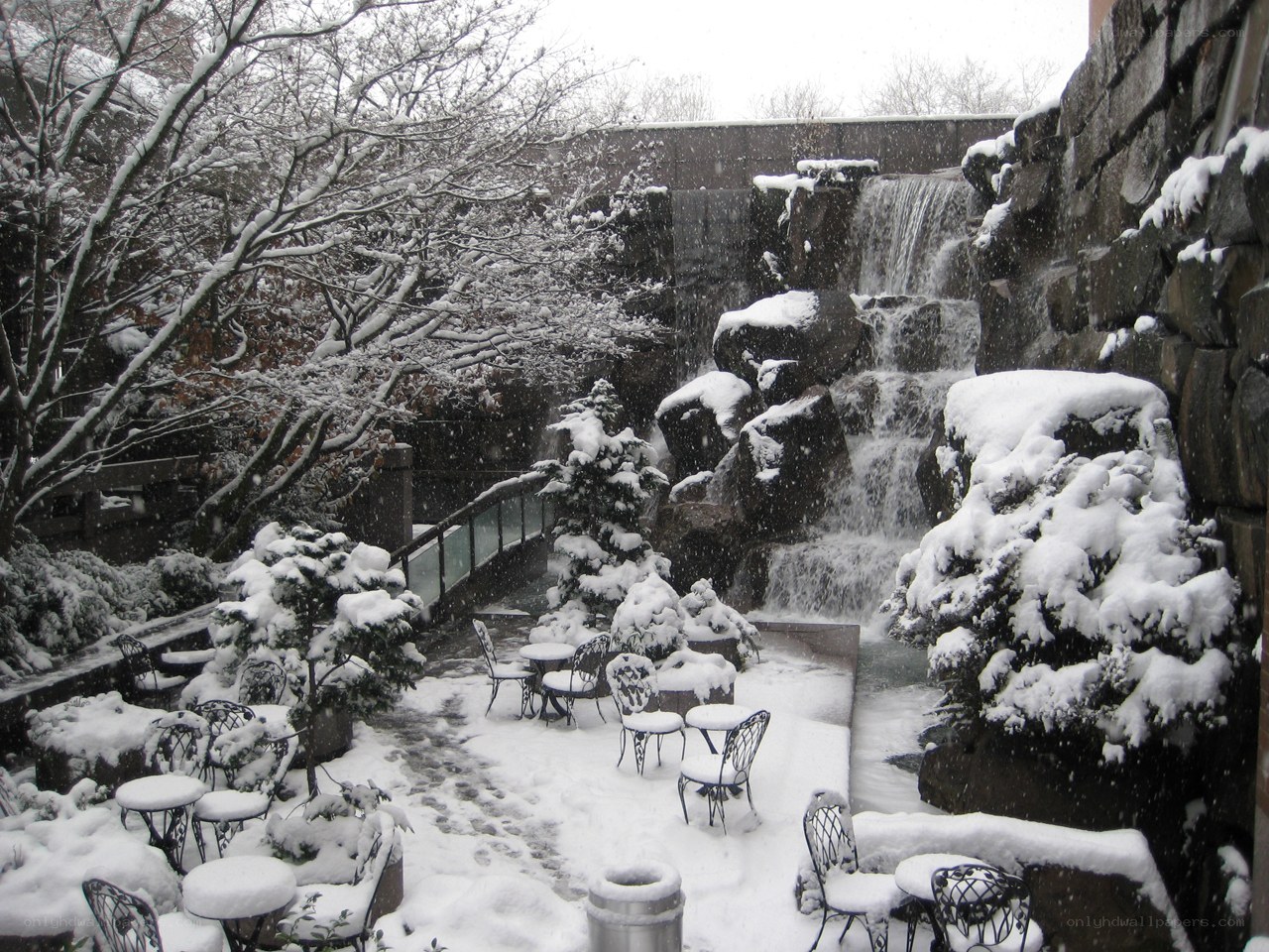 Snowy courtyard with waterfall