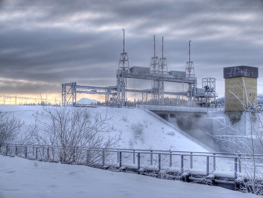 Snowy dam with power lines