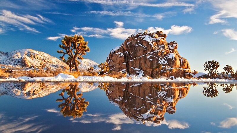 Snowy desert landscape with reflection
