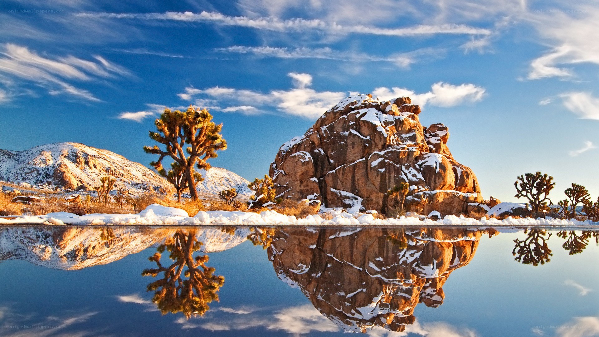 Snowy desert landscape with reflection