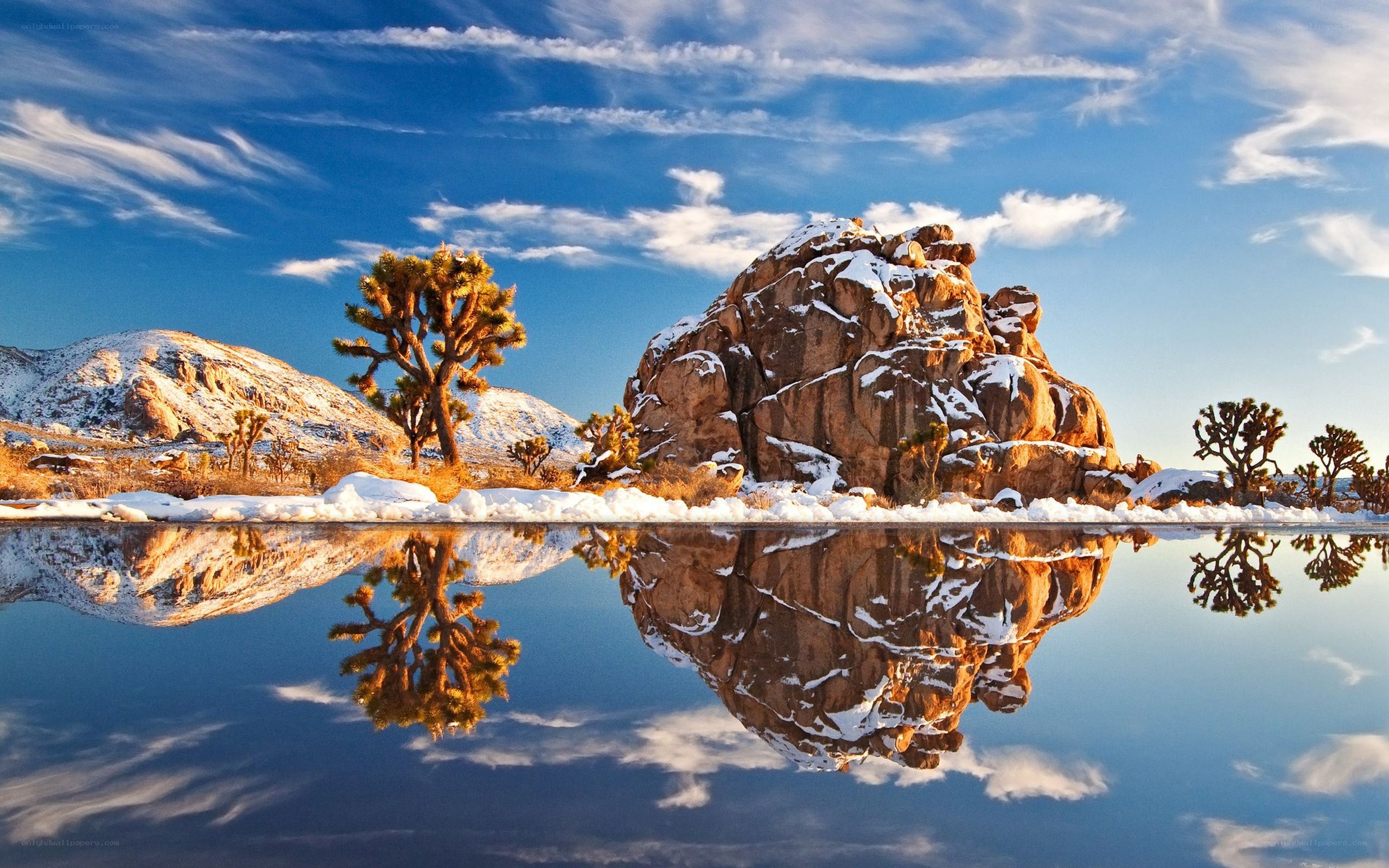 Snowy desert landscape with reflection