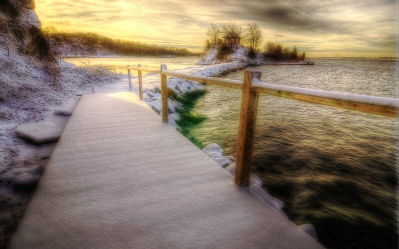 Snowy dock at sunset