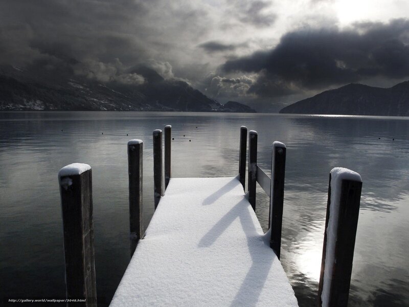 Snowy dock on a lake