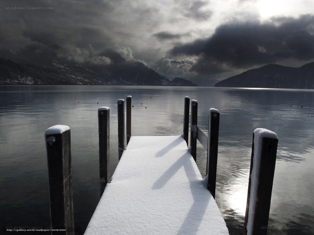 Snowy dock on a lake