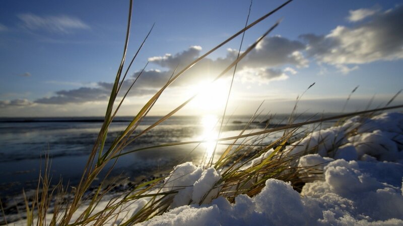 Snowy dune at sunset