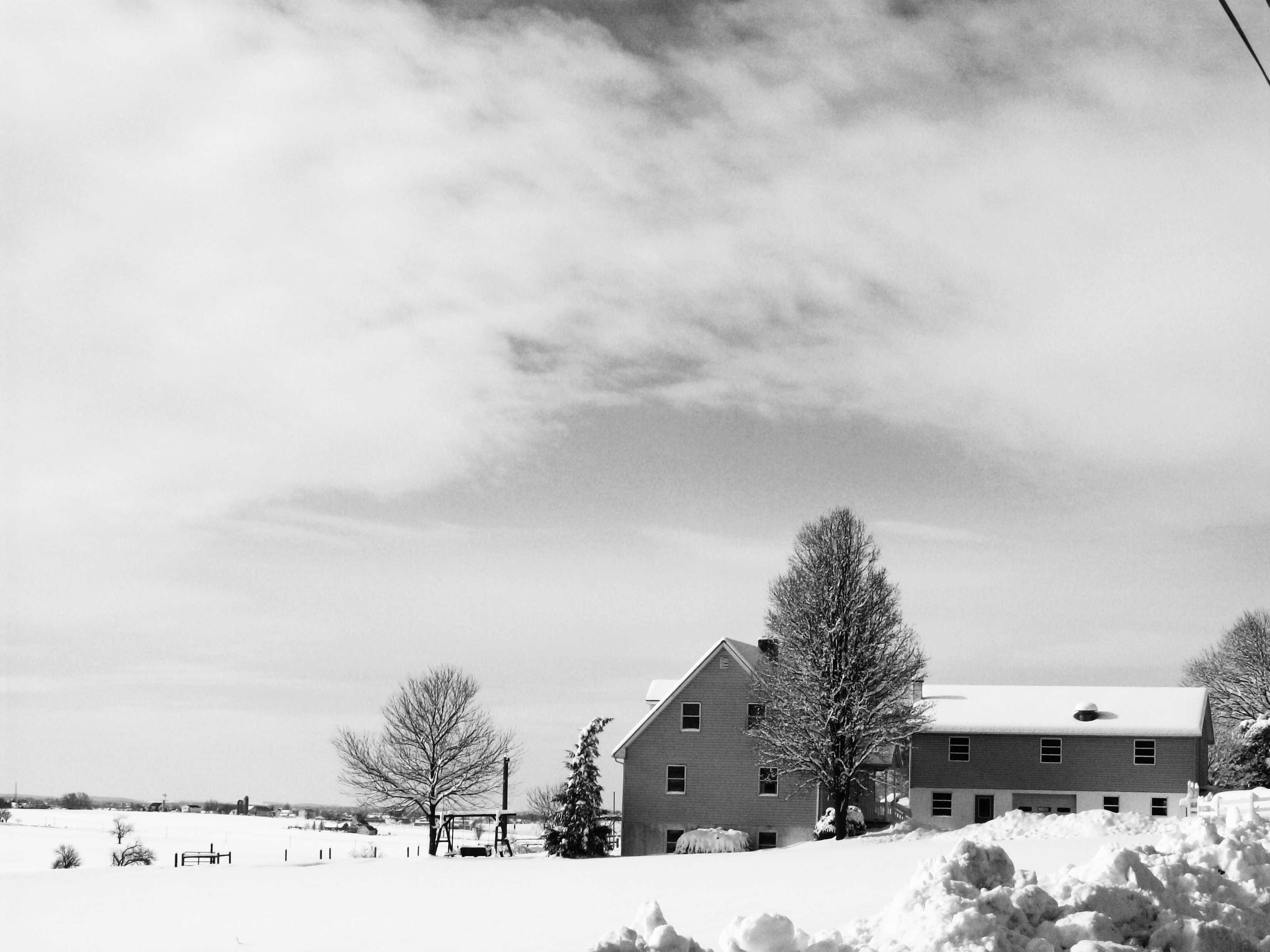 Snowy farm house scene