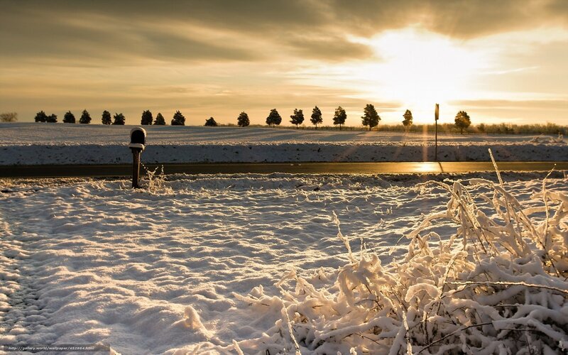 Snowy field at sunset